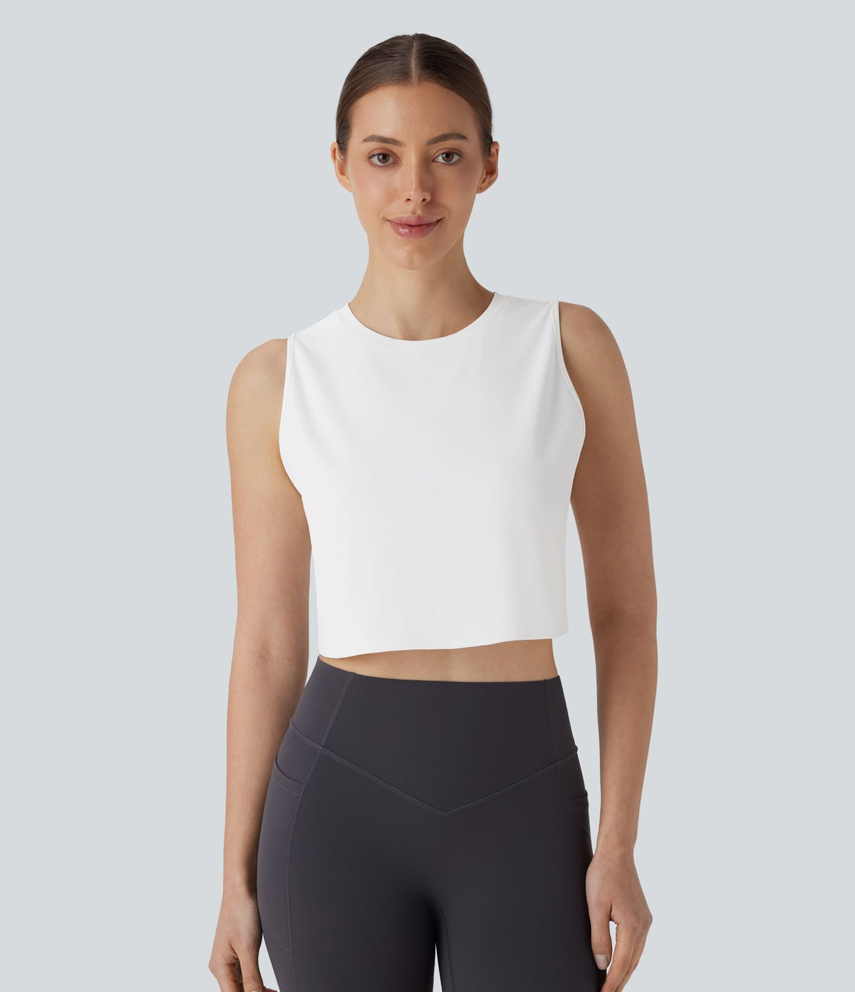 Débardeur Court de Yoga Uni à Ourlet Croisé avec Découpes